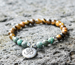 BRACCIALE ELASTICO CON PERLE IN PIETRA DURA OCCHIO DI TIGRE E TURCHESE AFRICA MISURA DONNA 6 MM CON CIONDOLO FIORE DI LOTO