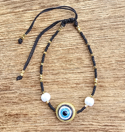 BRACCIALI LINEA SAMARKANDA CON PERLE DI FIUME MGB 15/0 E CHARM GOLD PLATED CON MOTIVO DEVIL EYE