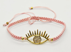 BRACCIALE FULL MACRAME' CON MEDAGLIA A FORMA DI OCCHIO IN METALLO GOLD PLATED CON ZIRCONI