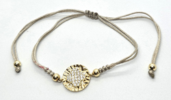 BRACCIALE STRING CON ZIRCONI SU METALLO GOLD PLATED CON QUADRIFOGLIO E DISCO MARTELE BIANCO