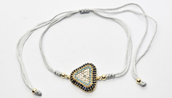 BRACCIALE STRING CON ZIRCONI SU METALLO GOLD PLATED E TRIANGOLO TURCHESE E NERO